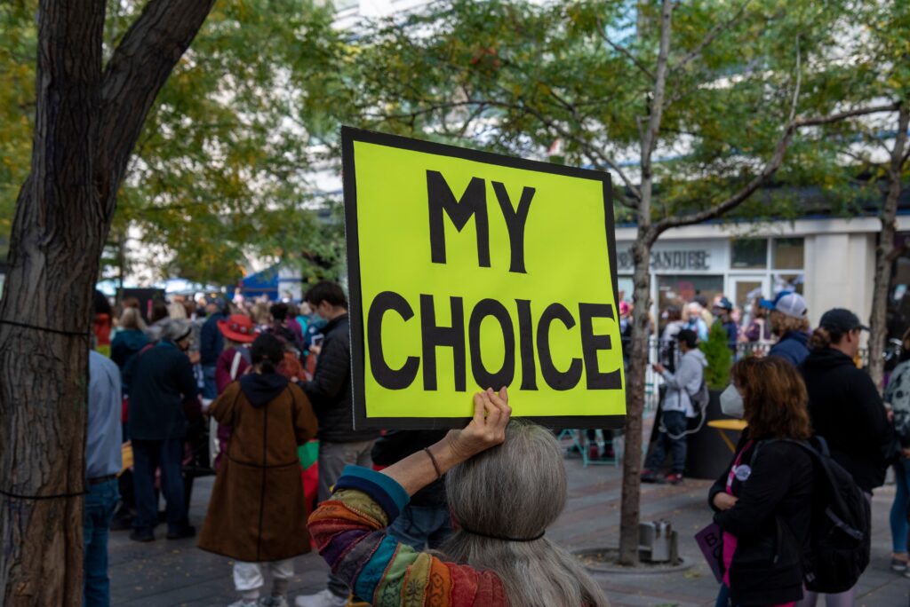 "My Choice" protest sign being held up at protest rally.